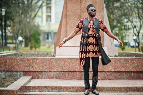 Preview: African stylish and handsome man in traditional outfit