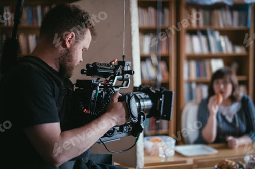 Preview: Director Of Photography With A Camera In His Hands On The Set. Professional Videographer At Work On