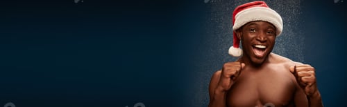Preview: joyful athletic african american guy in santa hat showing win gesture on dark snowy backdrop, banner