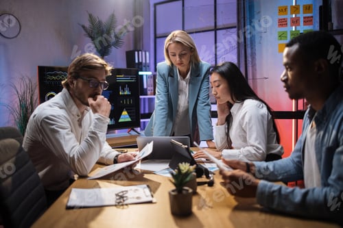 Preview: Multi ethnic company workers having briefing at office
