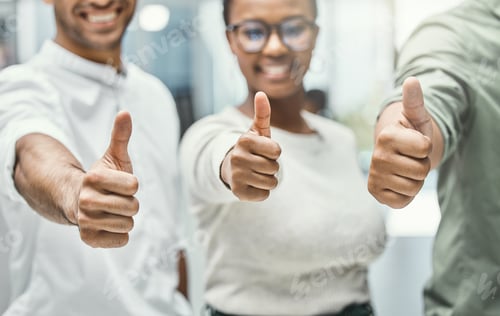 Preview: Shot of three businesspeople showing thumbs up while standing together