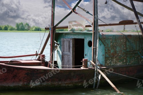 Preview: Closeup of an old rusty vessel on the lake.