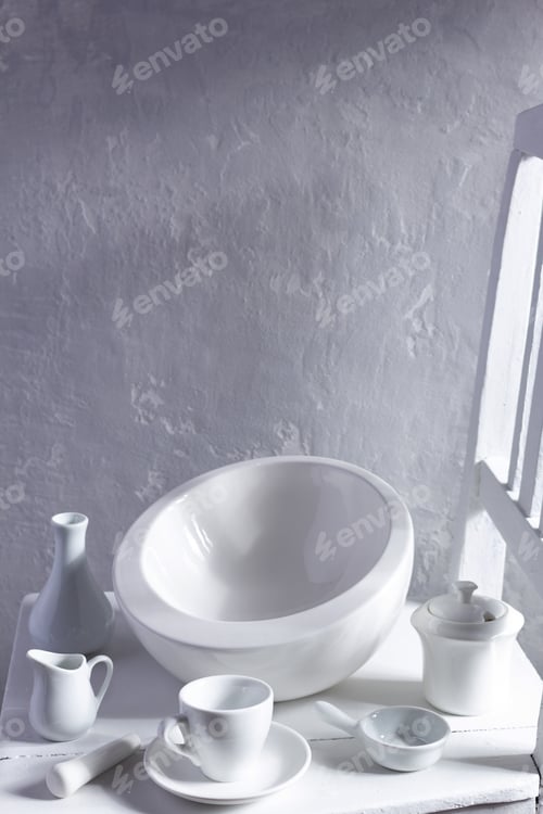 Preview: Empty crockery or ceramic dishes set. White kitchen dishware and tableware at wooden old chair