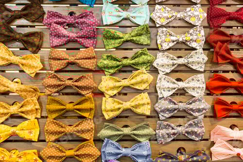 Preview: Colorful Bow Ties Displayed on Wooden Slatted Surface