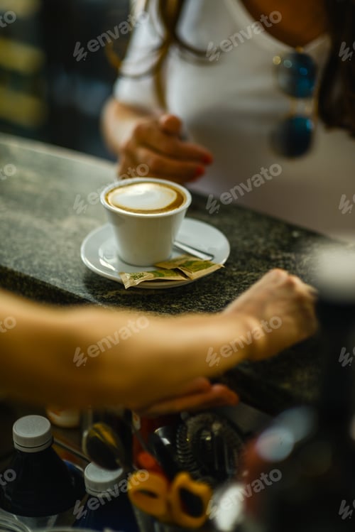 Preview: Espresso coffee, orange juice. and custard pastry cream croissant at the bar for breakfast.