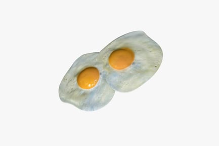 Preview: Halved fried eggs with intact yolks