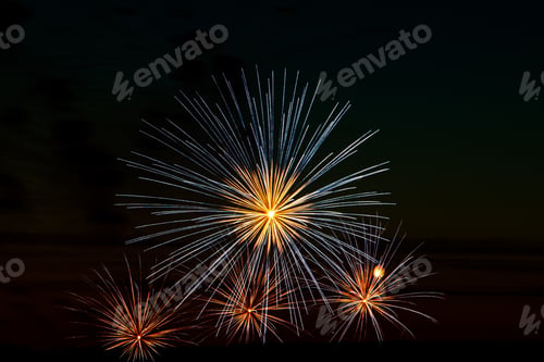 Preview: Bright multi-colored salute on a black background.