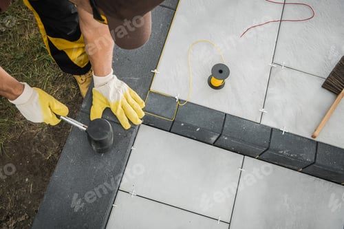 Preview: Landscaper Building Residential Patio Made From Concrete Bricks