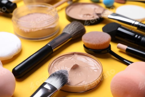 Preview: Composition with skin foundation and beauty accessories on color background