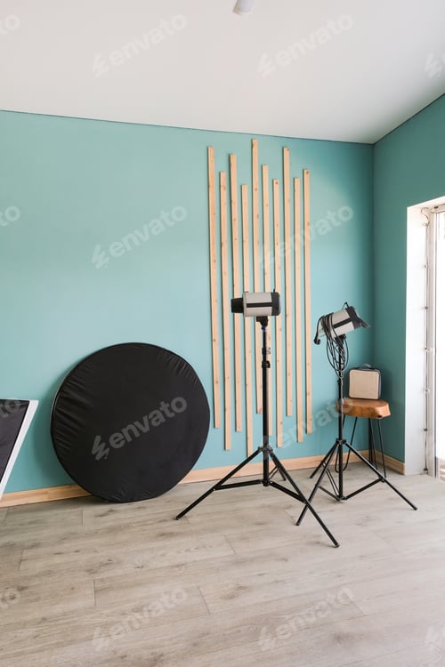 Preview: Professional equipment in photography studio with blue walls