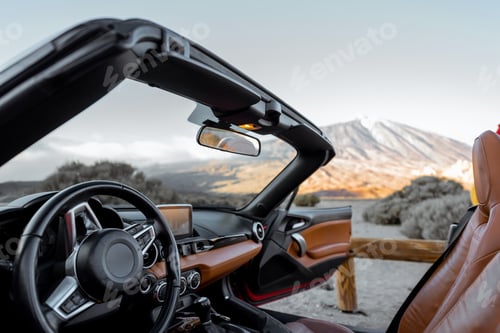 Preview: Convertiblle sports car on the mountain roadside