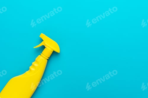 Preview: Yellow Plastic Dispenser on Blue Background with Copy Space