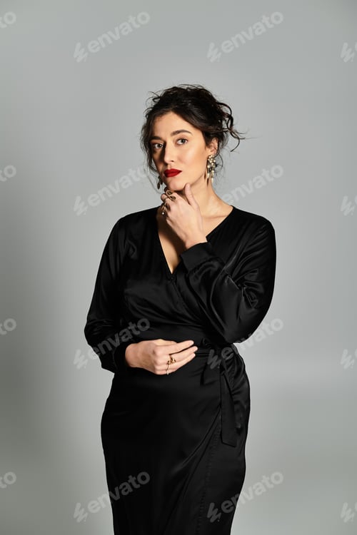 Preview: Stylish brunette woman posing elegantly in a sophisticated studio setting