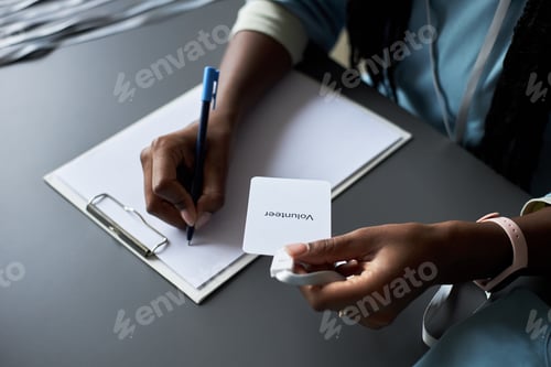 Preview: Writing Volunteer Information on Clipboard