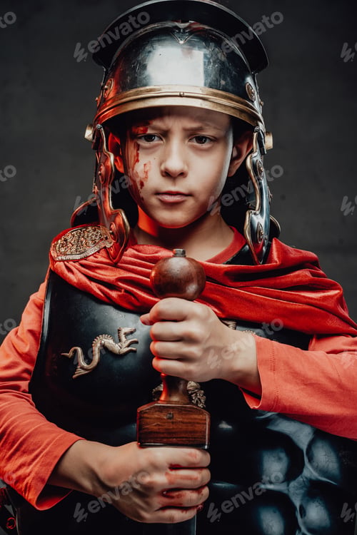 Preview: Boy in dark armour and red cape with sword in dark background