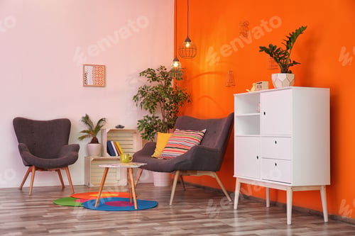 Preview: Interior of modern living room with pillows on sofa