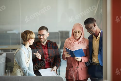 Preview: Multi-Ethnic Business Team Working in Conference Room