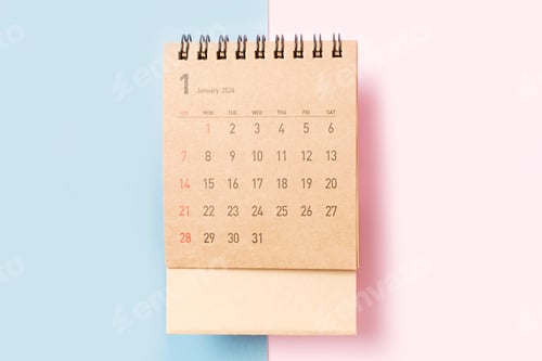 Preview: Brown calendar for January 2024 on blue and pink background close-up, planning concept.