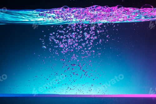 Bubbles underwater with purple and blue lighting