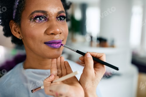 Preview: Close-up of African American woman getting ready for Mardi Gras party.