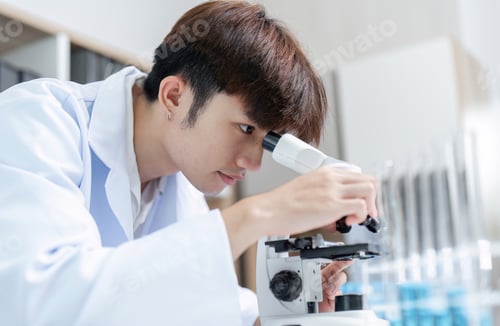 Preview: Researcher in Laboratory Examining Substance Under Microscope for Scientific Study and Analysis