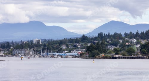Preview: City by the water, Marina with Boats, surrounded by Homes, mountains and trees. Summer Season.