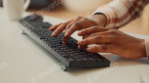 Preview: Young adult typing data to create report on computer