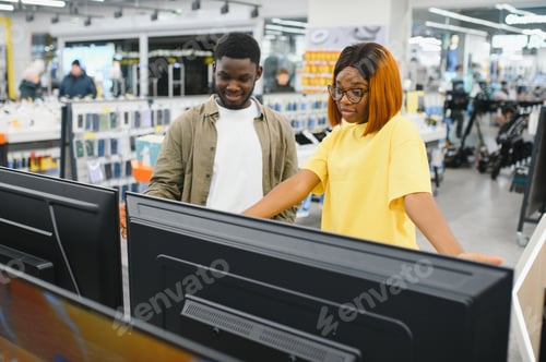 Preview: African american Couple looking for new TV to buy. New technologies concept.