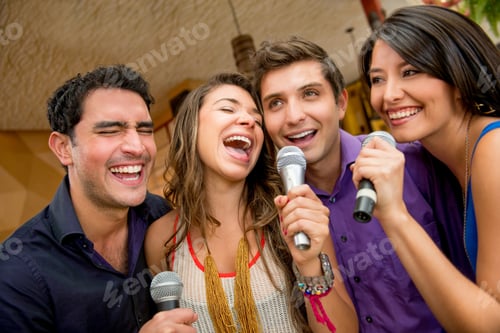 Preview: Group Of Friends Having Fun Karaoke Singing At The Bar