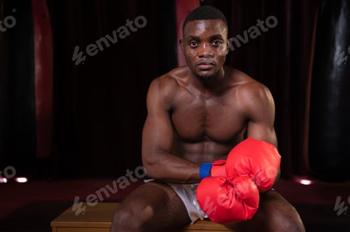 Preview: Portrait of boxer preparing to fight on stage to gain experience in the use of Muay Thai