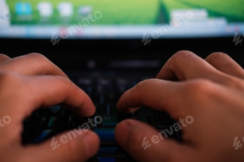 Preview: Person's hands typing on the computer