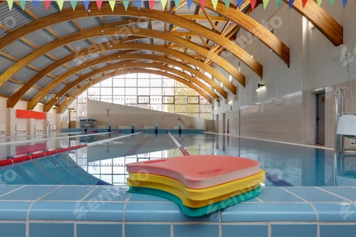 Preview: Indoor swimming pool, starting block, diving block and marked lanes, flat calm water