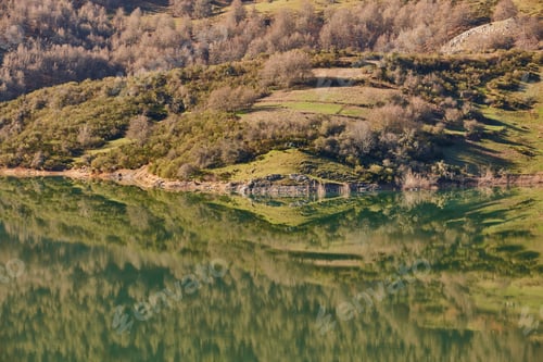 Preview: Picturesque reservoir and mountain landscape in Riano. Mirror effect. Spain