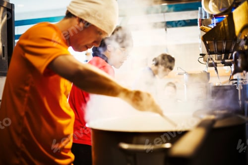 Preview: The ramen noodle shop. A chef stirring a huge pot of noodles cooking.