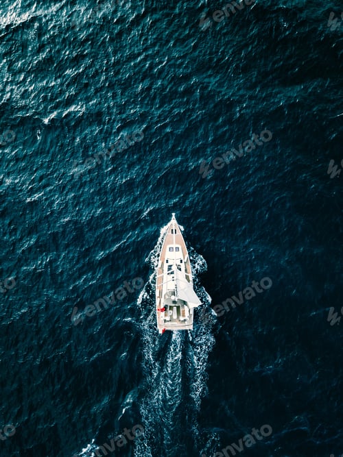 Preview: Aerial view of Sailing ship yachts with white sails in deep blue sea