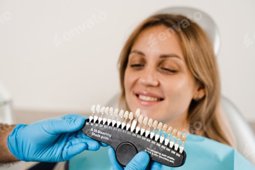 Preview: Teeth shade guide used with female patient for whitening and color matching