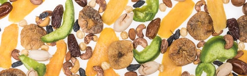 Preview: top view of Turkish assorted nuts, dried fruits and candied fruit isolated on white, panoramic shot