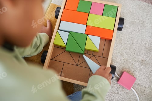 Preview: Kid Playing with Toys on Floor