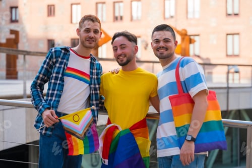 Preview: Portrait of man at the rally with the rainbow flags, gay pride party in the city, lgbt concept