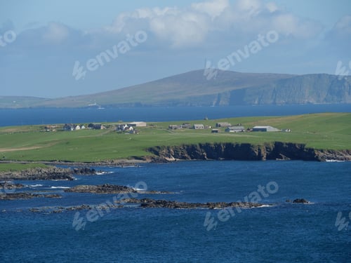 Preview: Stunning view of the Shetland Islands in Scotland, UK, blanketed in lush greenery and a tranquil sea