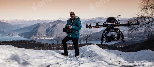 Preview: Mature man preparing to fly drone, Stresa, Piedmont, Italy