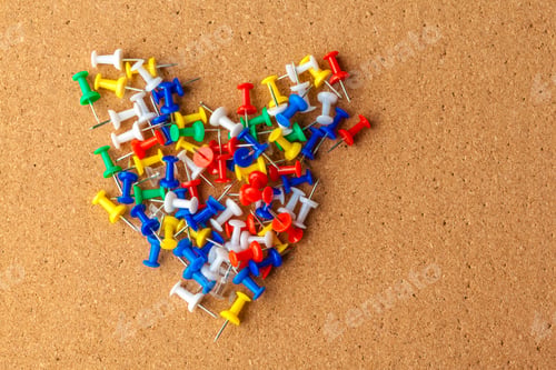 Preview: Group of colorful push pins on cork bulletin board