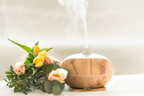 Preview: Aroma oil diffuser lamp on the table .