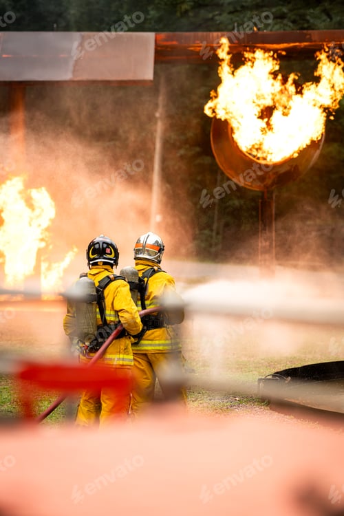 Preview: A group of firefighters uses high-pressure hoses to battle a massive blaze