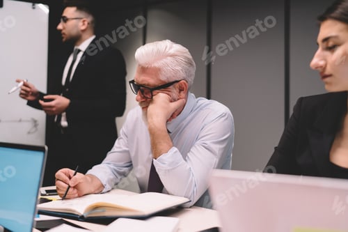 Preview: Speaker explaining strategy to businesspeople