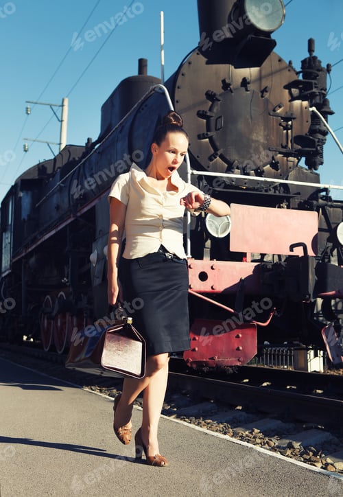 Preview: Woman with a suitcase looks at her clock