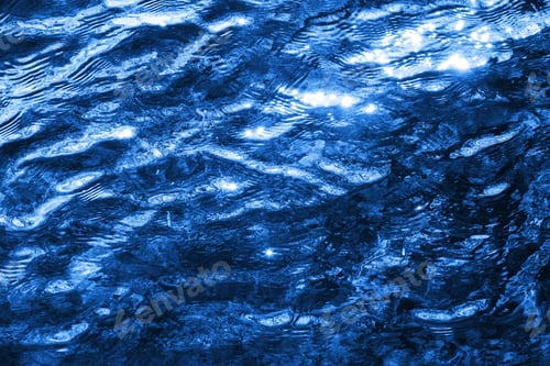 Preview: Sunlight Glistening on Blue Water Ripples Abstract