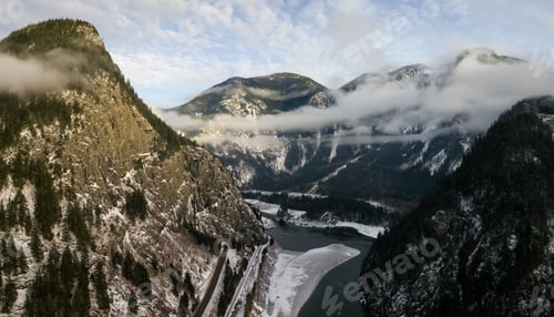 Preview: Aerial view of the Canadian Mountain landscape during a winter evening