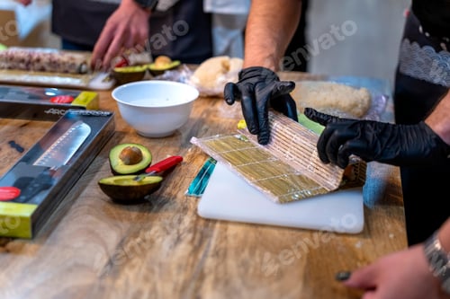 Preview: Sushi cooking workshop. Japanese chef explains the rolling technique