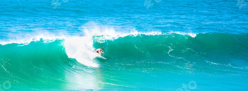 Preview: Person surfing in the sea on a sunny day